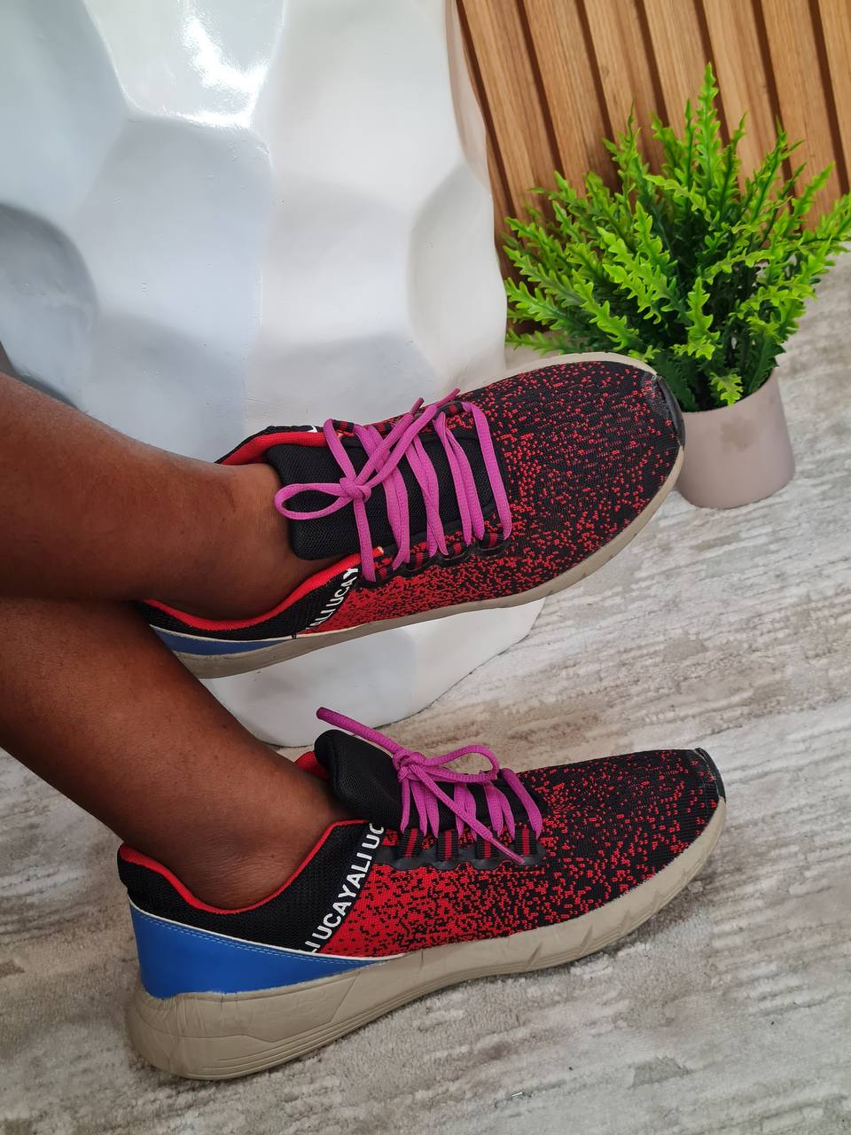 red sneakers with pink lace 
